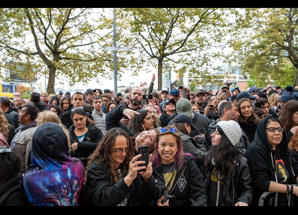 Fans gathering around the Chris Cornell statue at MoPOP